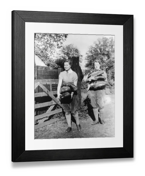 Framed Print : Land Army Girls carrying loaves of bread Framed Print : Land Army Girls carrying loaves of bread