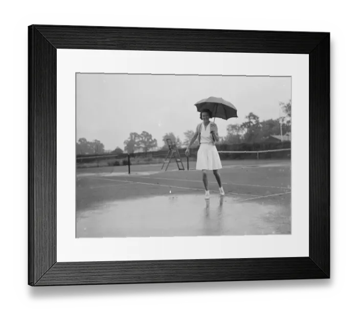 Framed Print : Tennis under difficulties - during a downpour. 1935 Framed Print : Tennis under difficulties - during a downpour. 1935