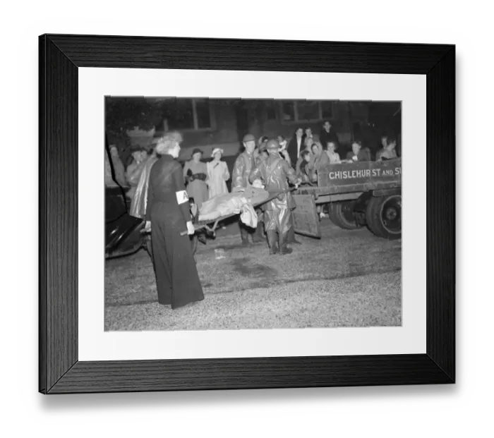 Framed Print : Casualties are being loaded into the back of a lorry during an air raid drill