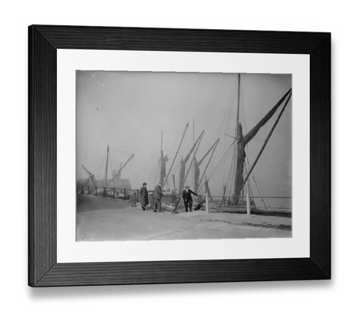 Framed Print : Old men on the riverside by the moored Thames sailing barges at Northfleet, Kent