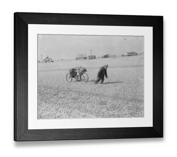 Framed Print : An old man pulling his tricycle along the shingle beach at Dungeness in Kent with Framed Print : An old man pulling his tricycle along the shingle beach at Dungeness in Kent with