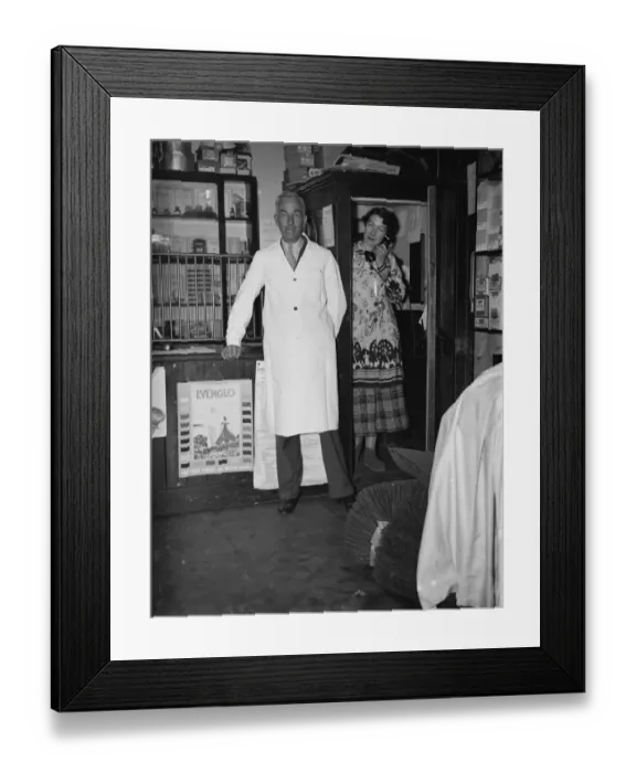Framed Print : Mr George May, Postmaster of Downe, Kent by his Post Office counter with his wife
