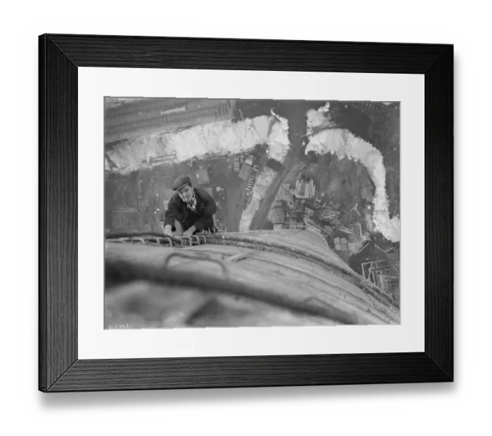 Framed Print : A workman climbs up on of the chimneys of the new coal electric power station under Framed Print : A workman climbs up on of the chimneys of the new coal electric power station under