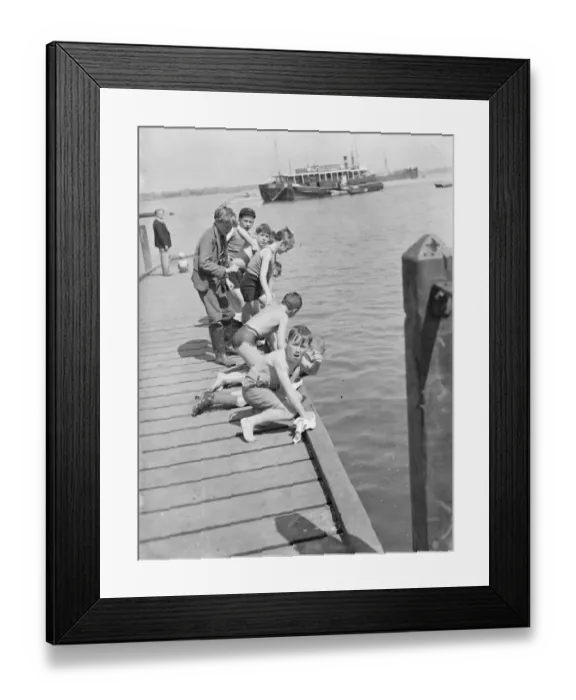 Framed Print : Boys play by the steps on the River Thames at Gravesend, Kent. 1939 Framed Print : Boys play by the steps on the River Thames at Gravesend, Kent. 1939