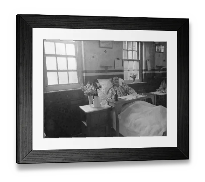 Framed Print : Gravesend Hospital in Kent. A male patient in bed. 1939 Framed Print : Gravesend Hospital in Kent. A male patient in bed. 1939