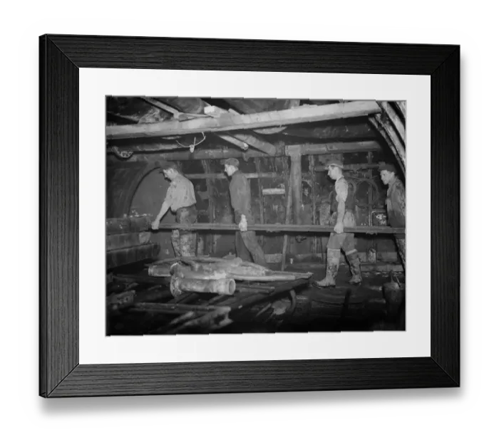 Framed Print : The Dartford tunnel men carrying part of the metal framework to its position Framed Print : The Dartford tunnel men carrying part of the metal framework to its position