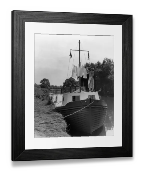 Framed Print : Washing day on holiday - Mrs M Usborne hanging out the washing around the mast of Framed Print : Washing day on holiday - Mrs M Usborne hanging out the washing around the mast of