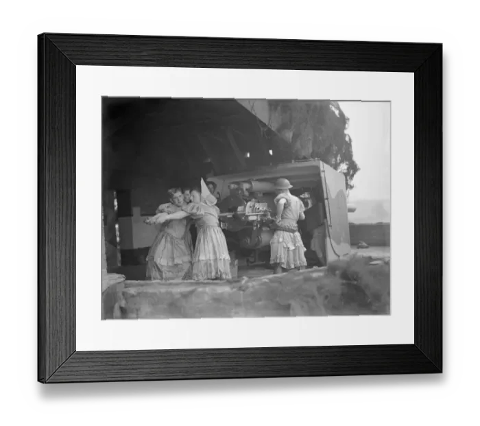 Framed Print : Home defence troops are left in drag as their Christmas charity performance was interrupted