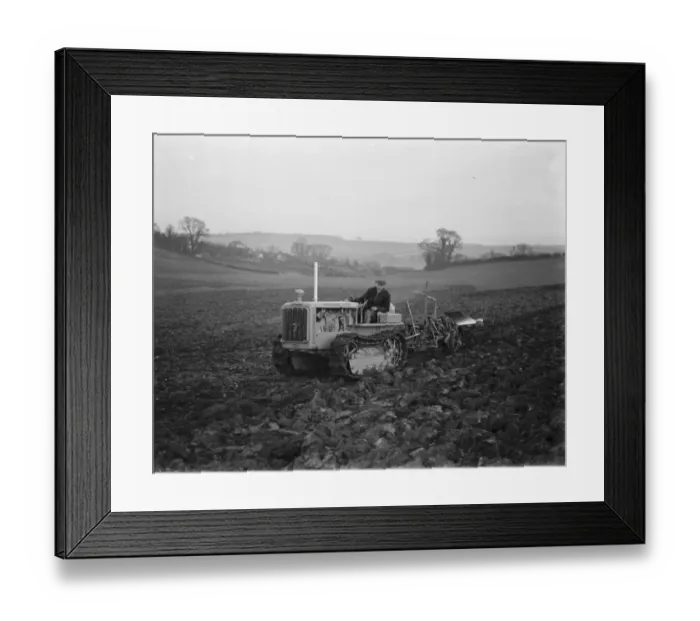 Framed Print : A farmer using his diesel caterpillar tractor to plough a field in Farningham, Kent Framed Print : A farmer using his diesel caterpillar tractor to plough a field in Farningham, Kent