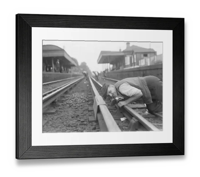 Framed Print : A railwayman gauging railway lines in Sidcup, Kent. 1937