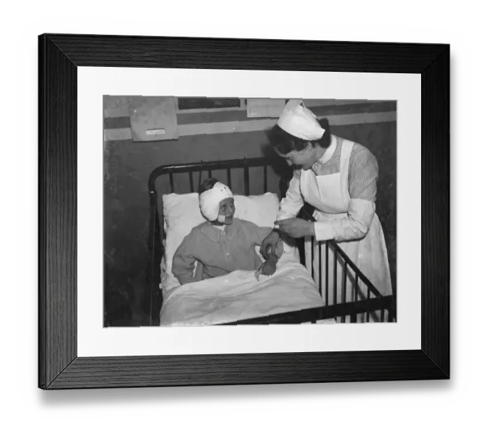 Framed Print : Gravesend Hospital in Kent. Nurse tending to a child patient. 1939 Framed Print : Gravesend Hospital in Kent. Nurse tending to a child patient. 1939
