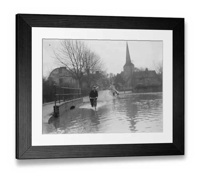 Framed Print : Flooding in Eynsford, Kent. Cyclist rides through the water. 1937