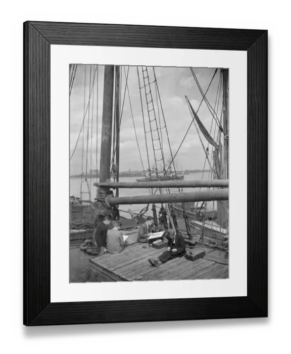 Framed Print : Pupils from the art school sit on the deck of a Thames Barge drawing pictures in Framed Print : Pupils from the art school sit on the deck of a Thames Barge drawing pictures in