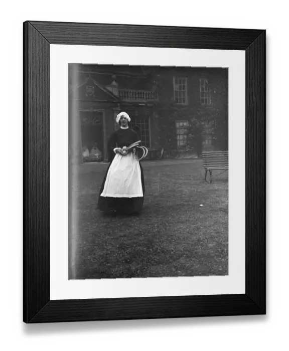 Framed Print : A woman in a servants period dress at Lullingstone Park near Eynsford, Kent Framed Print : A woman in a servants period dress at Lullingstone Park near Eynsford, Kent