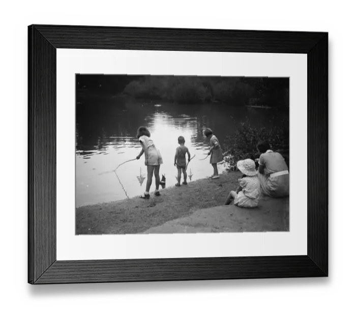 Framed Print : Children play with toy sailing boats in Dartford park. 24 August 1937 Framed Print : Children play with toy sailing boats in Dartford park. 24 August 1937