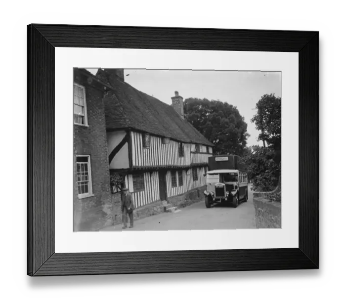 Framed Print : A bus passing a pretty cottage in Hollingbourne, Kent. 1935 Framed Print : A bus passing a pretty cottage in Hollingbourne, Kent. 1935