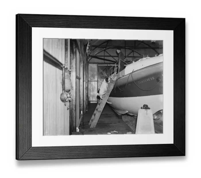 Framed Print : A sailor and a cocker spaniel on board a Dungeness life boat in Kent. 1939 Framed Print : A sailor and a cocker spaniel on board a Dungeness life boat in Kent. 1939