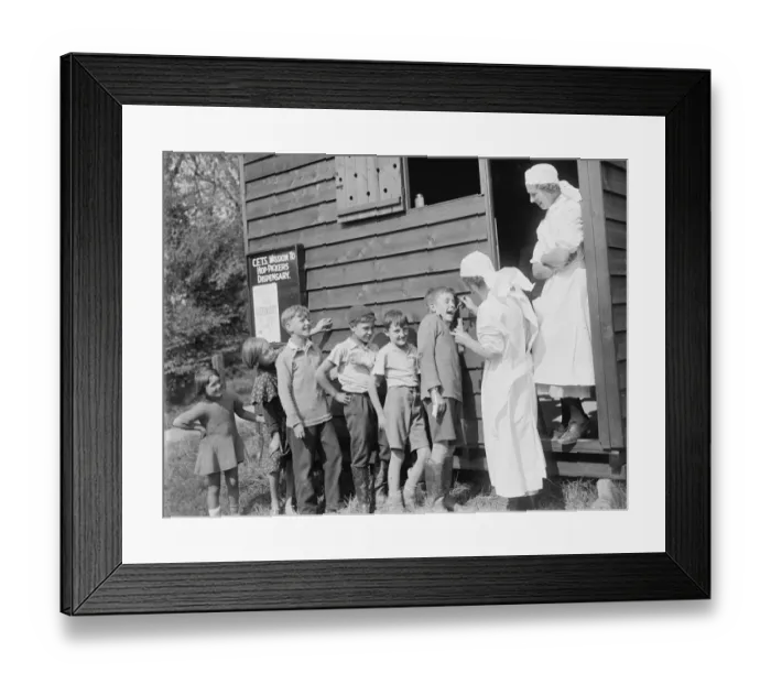 Framed Print : Hop - pickers dispensary, children receiving medicine. 1935 Framed Print : Hop - pickers dispensary, children receiving medicine. 1935