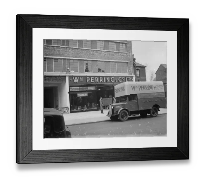 Framed Print : A Bedford truck belonging to W Perring and Co Ltd, the house furnishers. Workers Framed Print : A Bedford truck belonging to W Perring and Co Ltd, the house furnishers. Workers