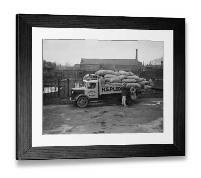 Framed Print : Workers are unloading sacks from a Bedford truck belonging to Pledge & Son Ltd Framed Print : Workers are unloading sacks from a Bedford truck belonging to Pledge & Son Ltd