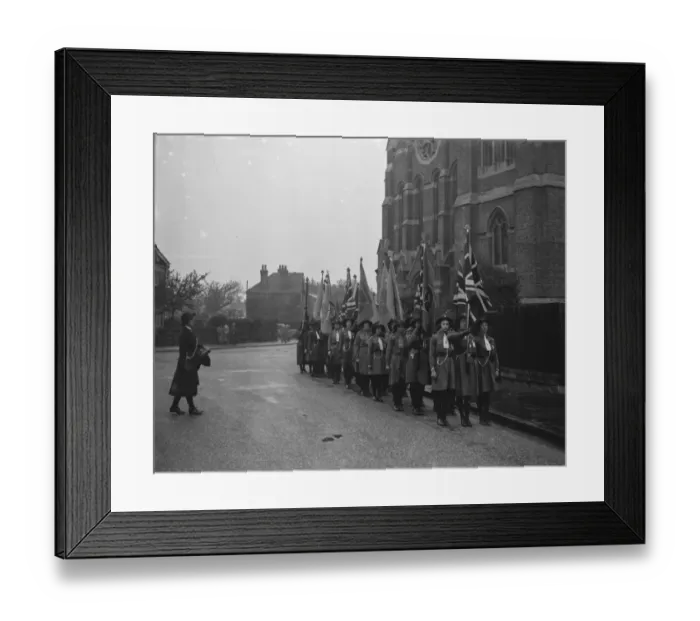 Framed Print : Girl guides during their church parade in front of the Parish Church of St John Framed Print : Girl guides during their church parade in front of the Parish Church of St John