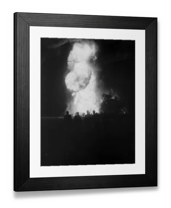 Framed Print : The silhouetted figures of men can be seen against the flames and smoke from Framed Print : The silhouetted figures of men can be seen against the flames and smoke from
