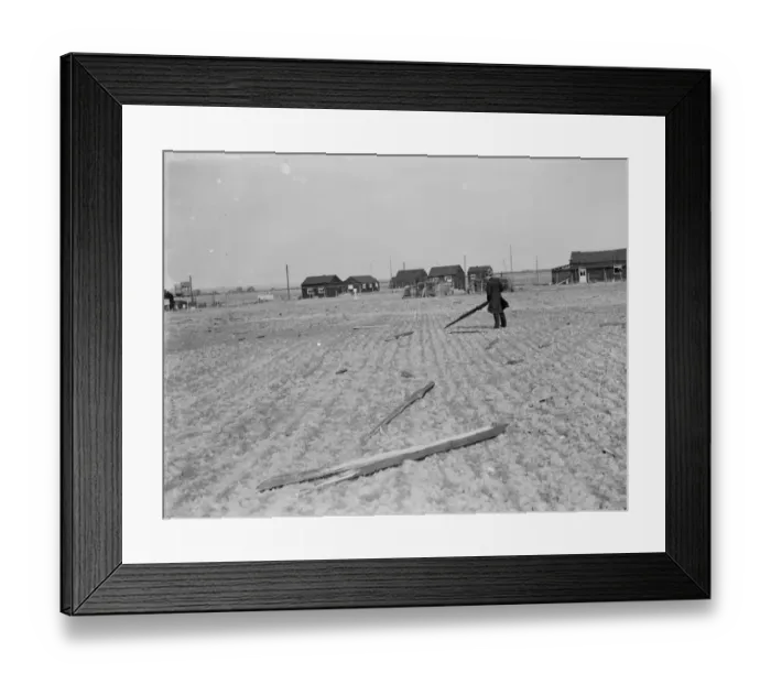 Framed Print : A man picking up the debris following a factory explosion in Faversham, Kent Framed Print : A man picking up the debris following a factory explosion in Faversham, Kent
