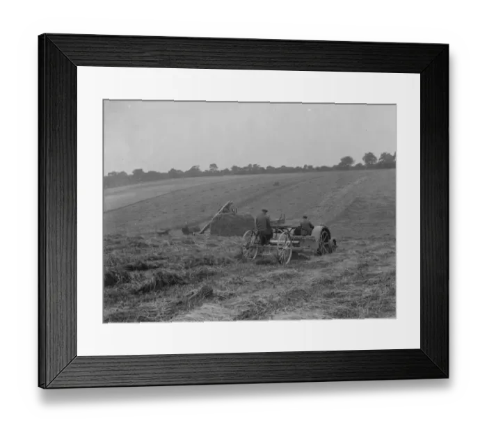 Framed Print : Farmers using a new tractor drawn haymaking machine on a field in Farningham, Kent Framed Print : Farmers using a new tractor drawn haymaking machine on a field in Farningham, Kent