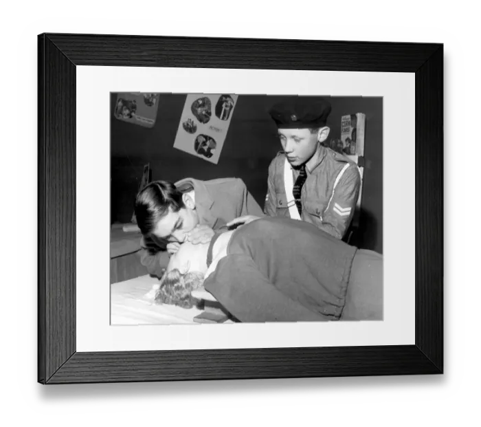 Framed Print : Colin Christian from Torquay practising the Kiss of Life rescue breathing technique Framed Print : Colin Christian from Torquay practising the Kiss of Life rescue breathing technique
