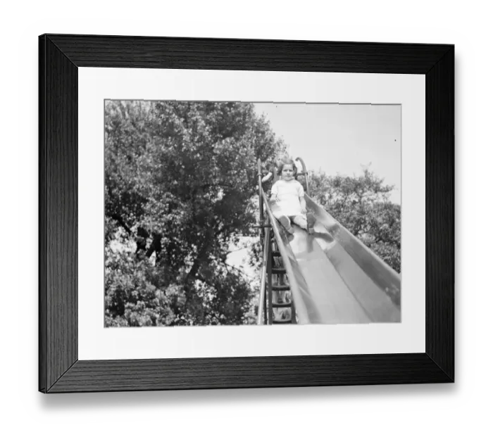 Framed Print : A young girl on a slide in Dartford, Kent. 1939 Framed Print : A young girl on a slide in Dartford, Kent. 1939