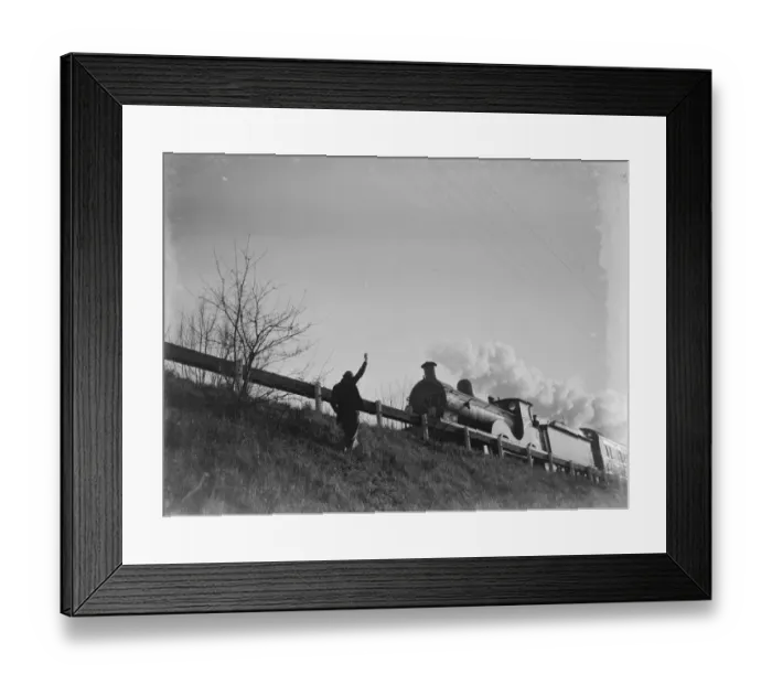 Framed Print : Muriel Haken waves to a passing train from a railway embankment. 1939 Framed Print : Muriel Haken waves to a passing train from a railway embankment. 1939