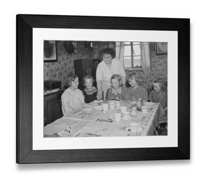 Framed Print : Mrs W E Wakefield with her daughters sitting by the dining table at their home in Framed Print : Mrs W E Wakefield with her daughters sitting by the dining table at their home in