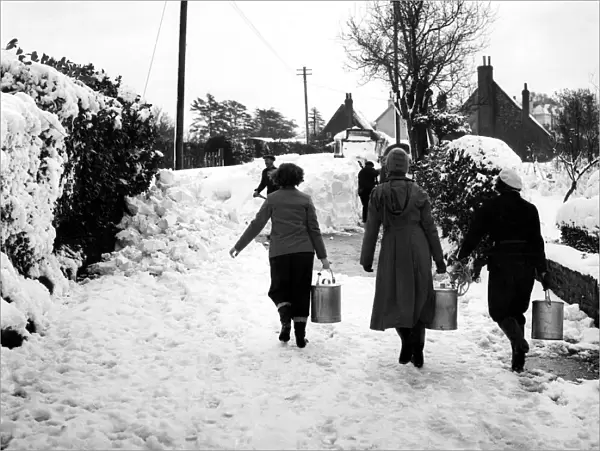Three volunteers taking milk to the Villager of Cudham, Kent, who were cut off by