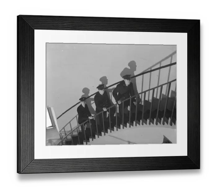 Framed Print : LIghthouse keepers walking up the spiral staircase inside the Dungeness lighthouse, Kent Framed Print : LIghthouse keepers walking up the spiral staircase inside the Dungeness lighthouse, Kent