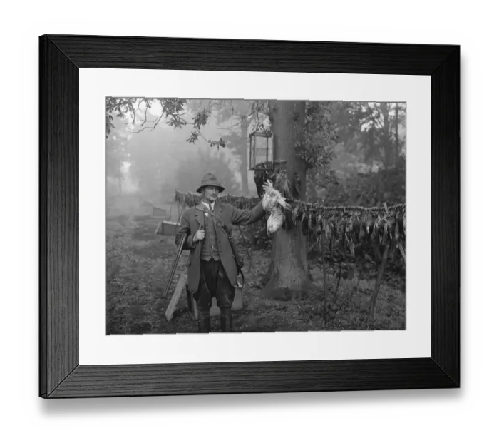 Framed Print : Gamekeeper, Mr Barrett, poses with a hawk he has killed. 1936 Framed Print : Gamekeeper, Mr Barrett, poses with a hawk he has killed. 1936