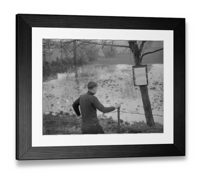 Framed Print : A boy looks at the flooded Sidcup swimming pool - flooded due to the bad weather Framed Print : A boy looks at the flooded Sidcup swimming pool - flooded due to the bad weather