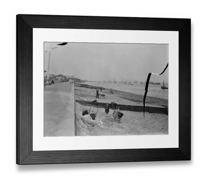 Framed Print : Members of the public relax on the opened beaches of the river Thames in Gravesend