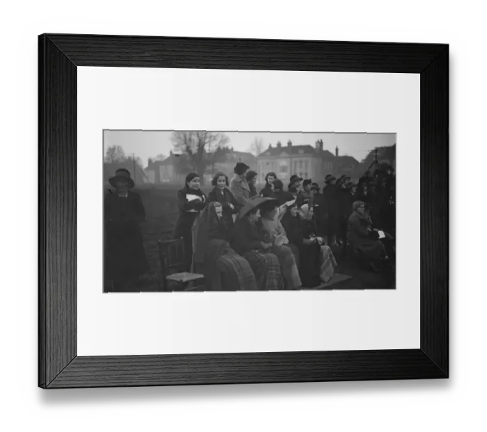Framed Print : Spectators try to keep warm and dry during the Lacrosse match - East versus West Framed Print : Spectators try to keep warm and dry during the Lacrosse match - East versus West