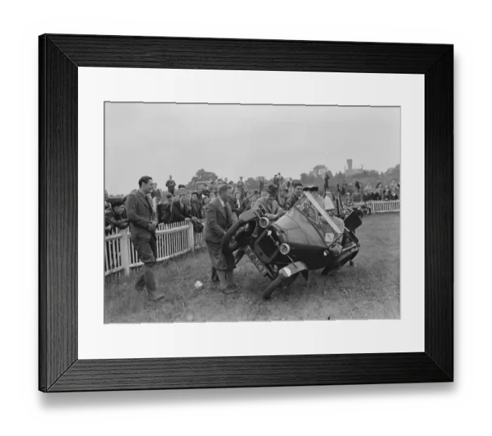 Framed Print : The Gravesend and District Motor Cycle Gymkhana. Clown driving a car on two wheels Framed Print : The Gravesend and District Motor Cycle Gymkhana. Clown driving a car on two wheels