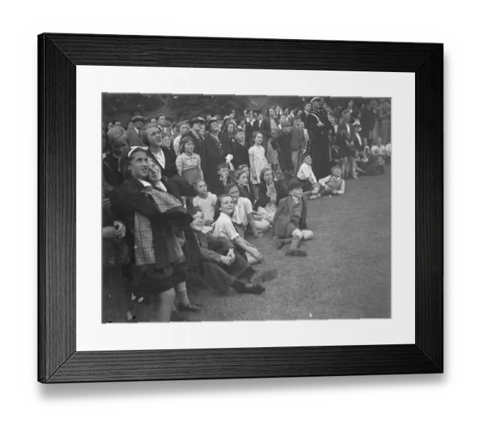 Framed Print : The crowd watching a trapeze artist performing at the Sidcup fete in Kent Framed Print : The crowd watching a trapeze artist performing at the Sidcup fete in Kent