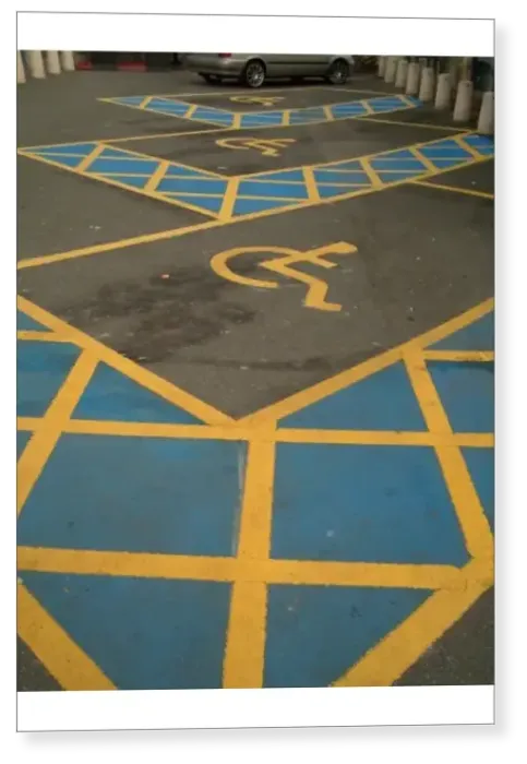 Print : Brightly painted extra wide spaces with the wheelchair symbol to ensure no misunderstanding