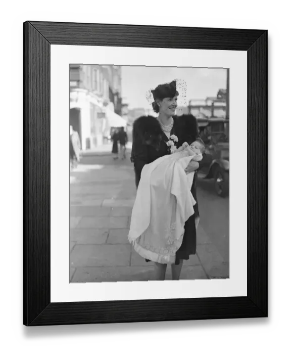 Framed Print : Mrs C G F Pritchett holds her infant son after the babys christening at St Pauls Church Framed Print : Mrs C G F Pritchett holds her infant son after the babys christening at St Pauls Church
