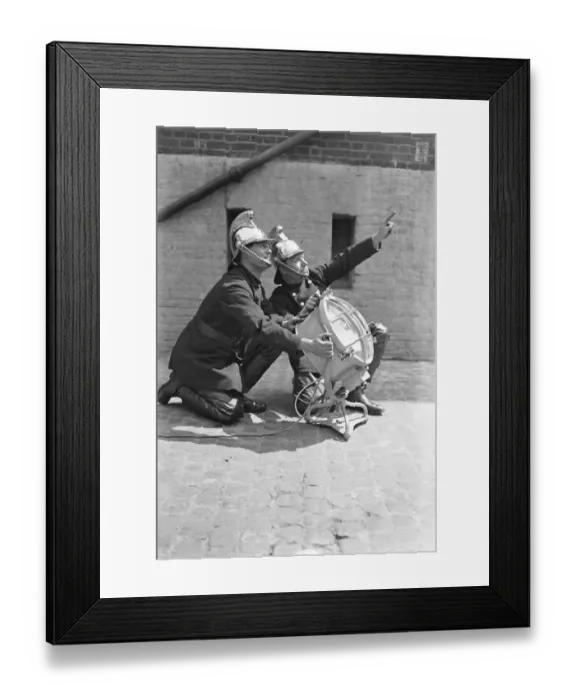 Framed Print : Positioning the light Taken at London Fire Brigade Headquarters. 19 September 1932 Framed Print : Positioning the light Taken at London Fire Brigade Headquarters. 19 September 1932