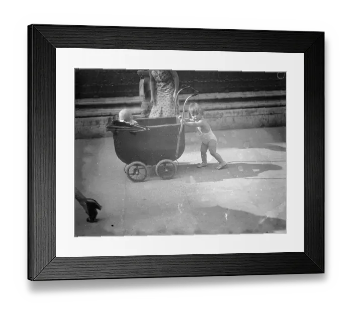 Framed Print : Piccadilly heat wave parade. In the briefest of bathing costumes this little girl Framed Print : Piccadilly heat wave parade. In the briefest of bathing costumes this little girl