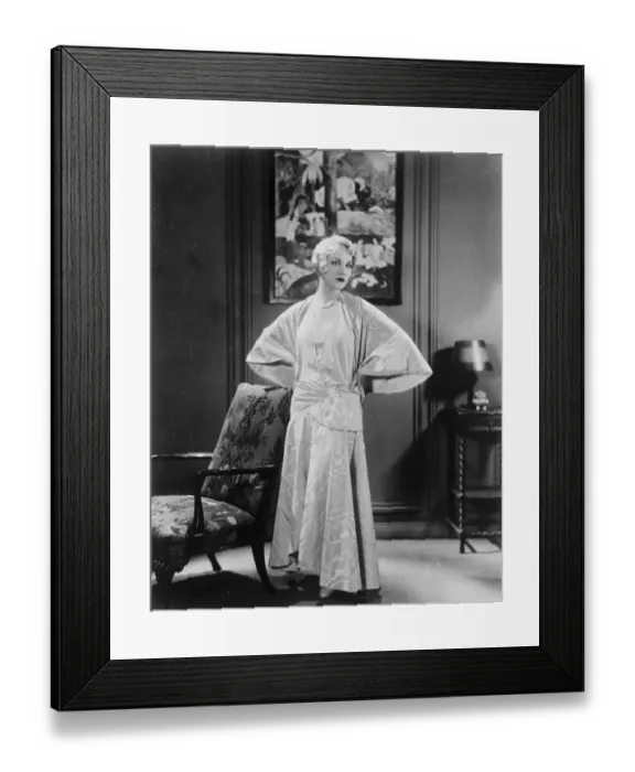Framed Print : Unusual evening frock worn with smart cape coat of same material. Moire treated Framed Print : Unusual evening frock worn with smart cape coat of same material. Moire treated