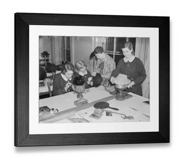 Framed Print : Feminine fingers taught intricacies of a fashion. Girl students at work in the millinery Framed Print : Feminine fingers taught intricacies of a fashion. Girl students at work in the millinery