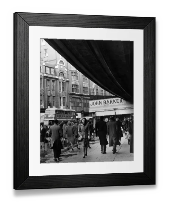 Framed Print : The shoppers are well wrapped up against Londons draughty climate, Kensington High Street Framed Print : The shoppers are well wrapped up against Londons draughty climate, Kensington High Street