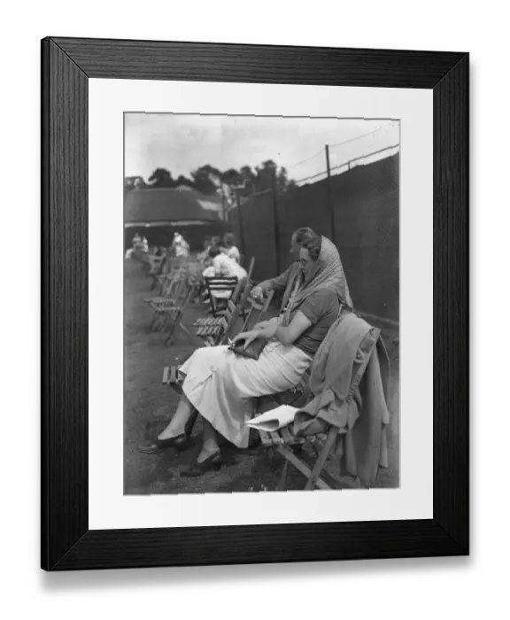Framed Print : At the Brockenhurst Junior Tennis Tournament, Mrs Paul Peatling watches a match. 1937 Framed Print : At the Brockenhurst Junior Tennis Tournament, Mrs Paul Peatling watches a match. 1937