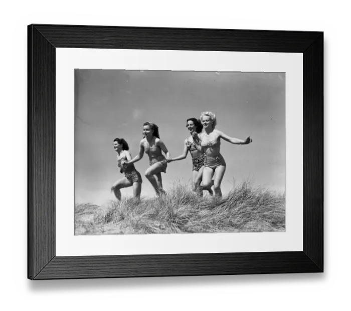 Framed Print : First dip of the season was a happy occasion for these holiday girls at Bournemouth
