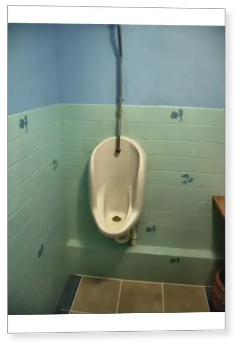 Print : Urinal with a pretty tiled blue wall Print : Urinal with a pretty tiled blue wall